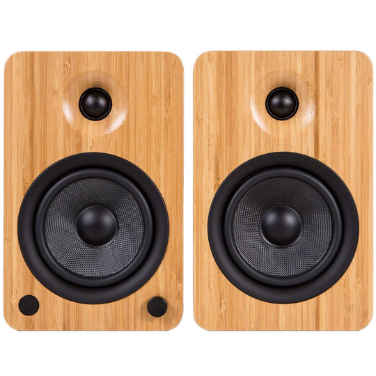 Kanto YU6 powered bookshelf speakers in bamboo finish, featuring Kevlar drivers and silk dome tweeters for quality sound.