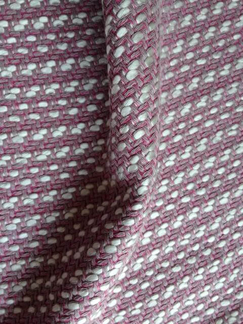 Soft pink and white woven fabric, showcasing quality texture for affordable cushion covers and home decor.