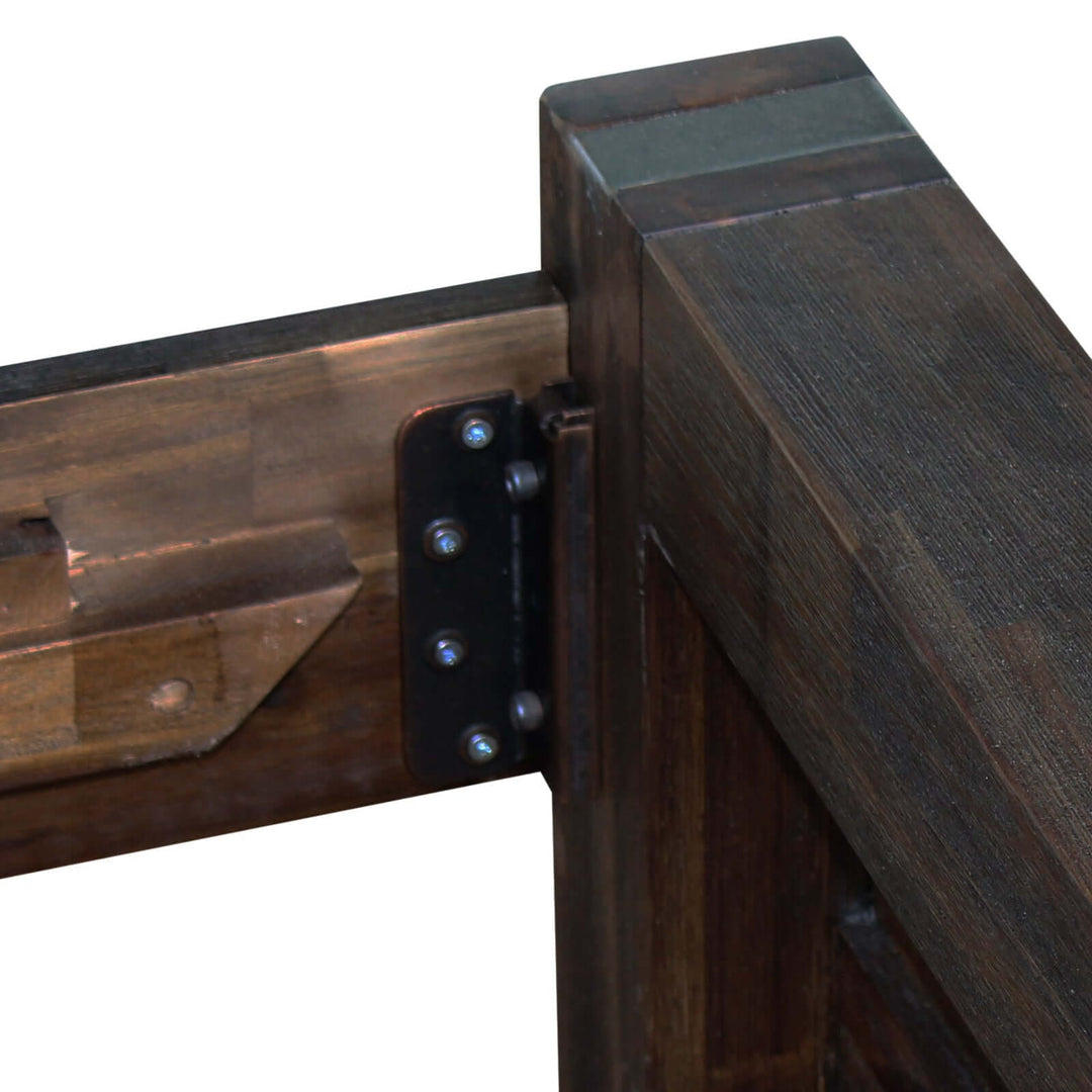 Solid wood bed frame corner detail in acacia timber with metal bracket construction