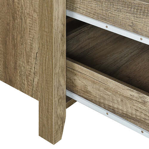 Close-up of dresser with natural wood finish, showcasing storage drawer and sturdy construction in oak color.