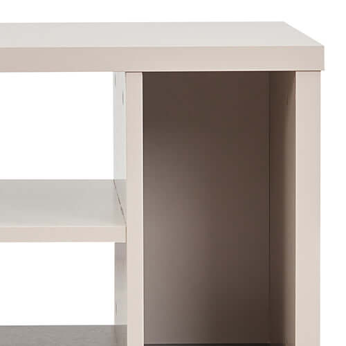 Close-up of a champagne-colored MDF lamp table showcasing three open storage cabinets with a minimal design.