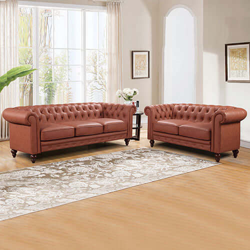 Affordable brown sofa lounge set with button tufted design in faux leather, featuring rolled arms and rubber wood legs.