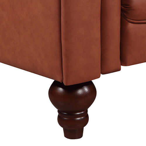 Close-up of the rolled brown leather sofa leg, showcasing detailed craftsmanship and luxurious design.