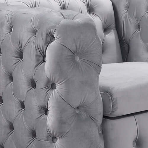 Detailed view of a classic button-tufted grey velvet 3 seater sofa, showcasing its luxurious quality and stylish design.