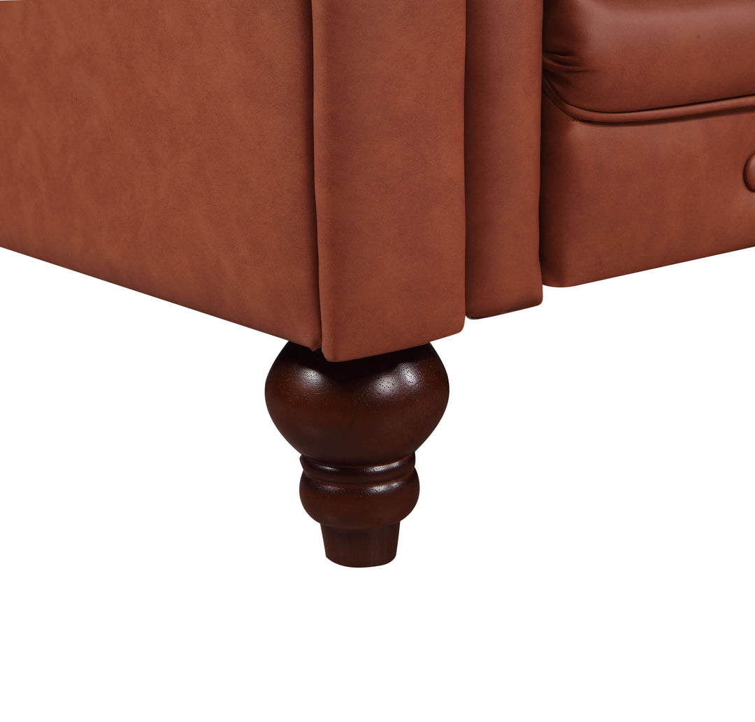 Close-up of a luxurious brown faux leather sofa leg, featuring a stylish wood finish and button tufted details.