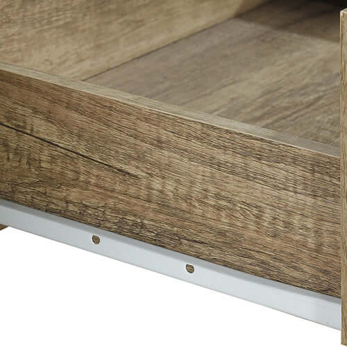 Close-up of the natural wood-like MDF texture of a TV cabinet drawer with smooth edges and metal support rail.