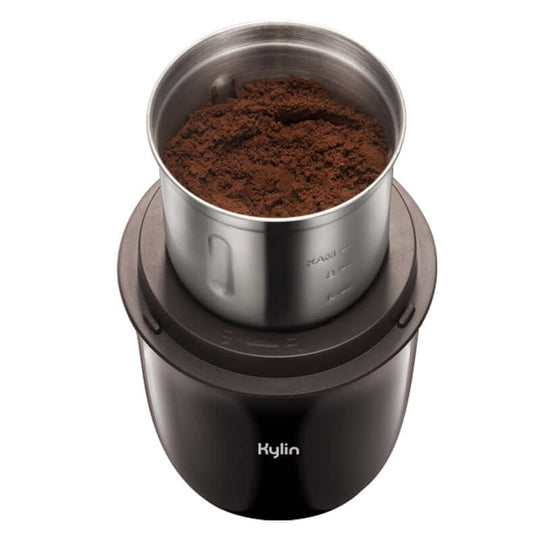 Kylin Electric Coffee Grinder with freshly ground coffee, compact design for affordable quality and DIY use.