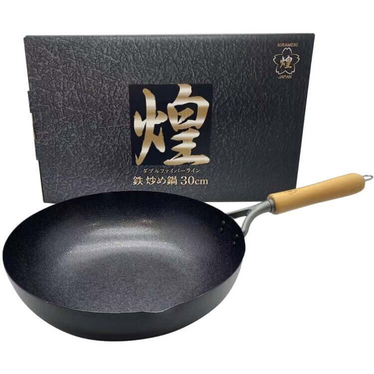 Kirameki 30cm Cast Iron Double Fiber Line Stir-fry Wok made in Japan, featuring a black finish and wooden handle in elegant packaging.