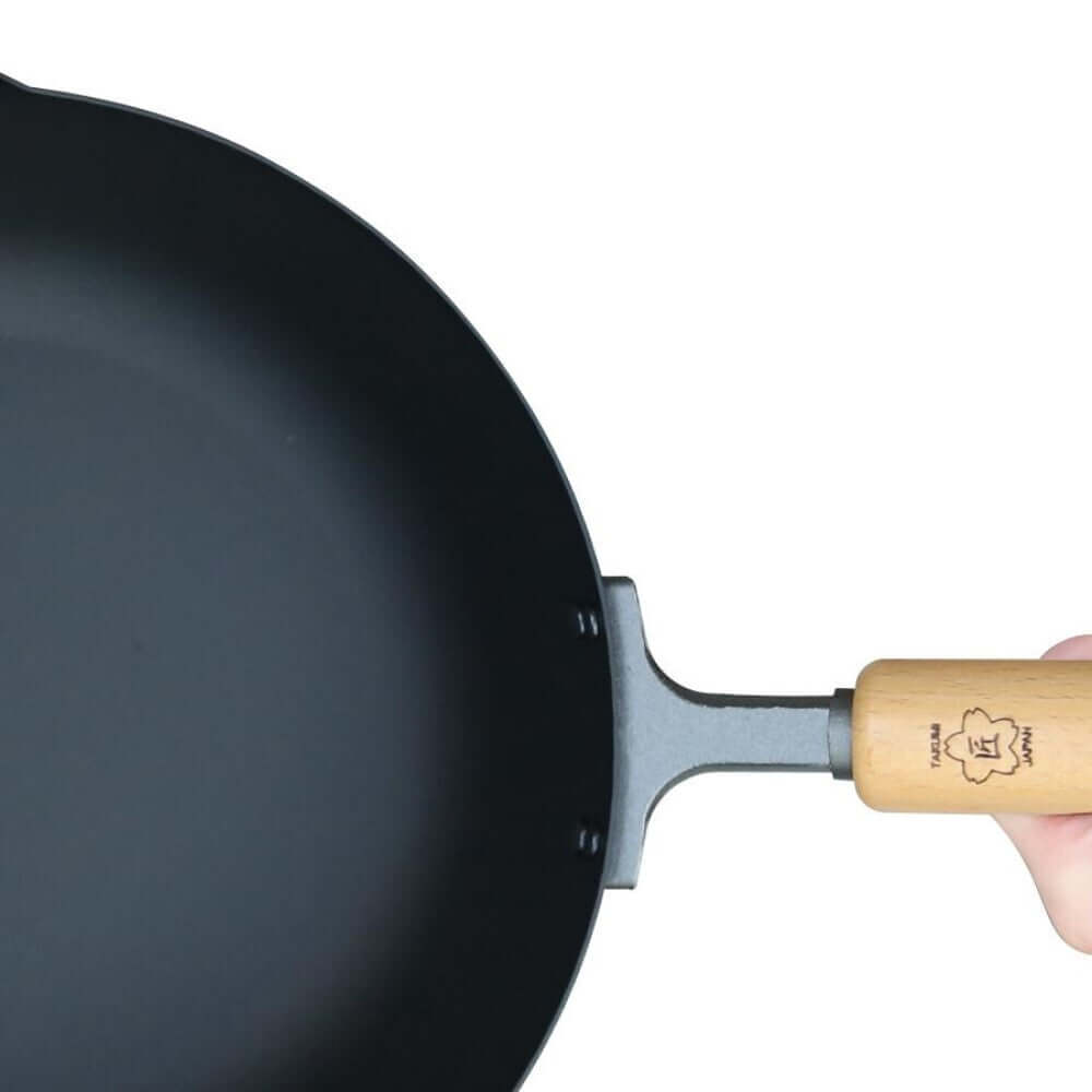 Takumi Premium Magma Plate Cast Iron Wok with wooden handle, made in Japan, 24cm, showcasing quality and durability.