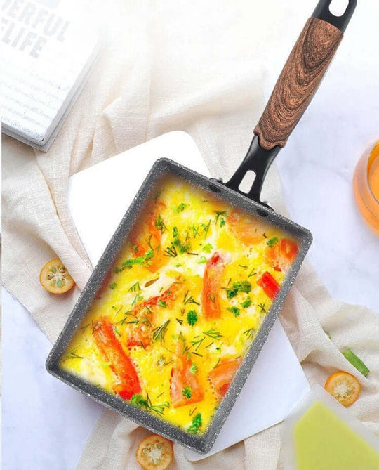 Hello Kitchen Marble Non-stick Tamagoyaki Fry Pan featuring a delicious omelette with vegetables on a stylish background.