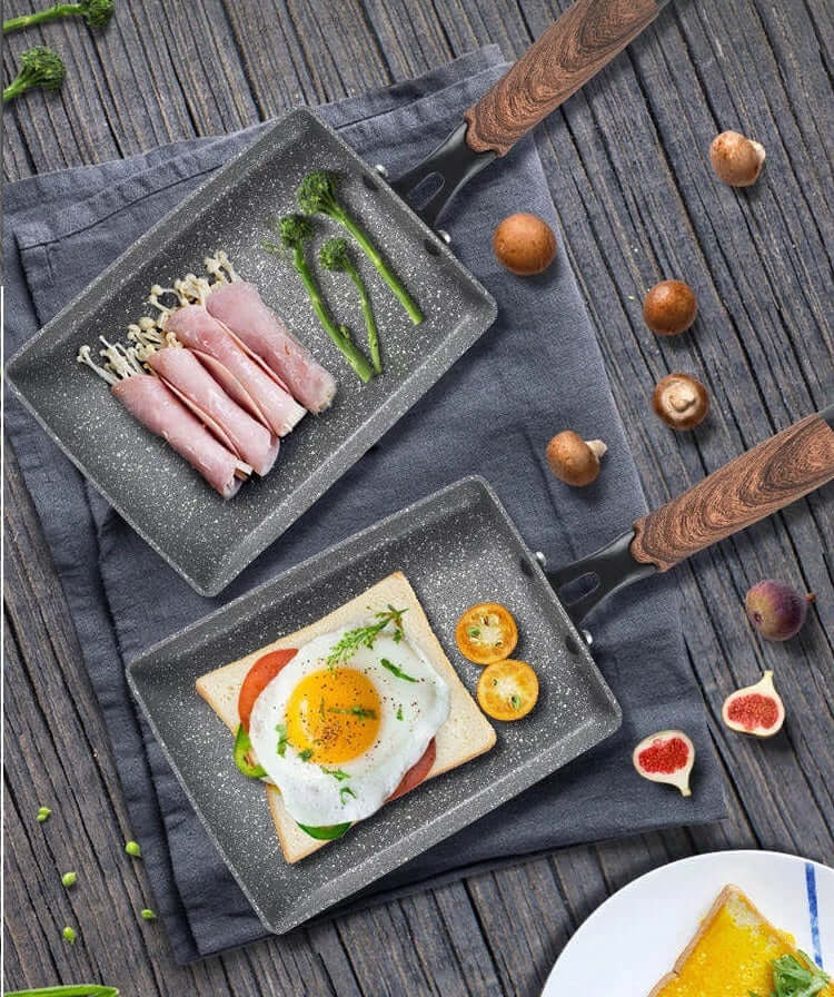 Two non-stick fry pans with vegetables and egg on a wooden table, showcasing affordable quality cooking tools for DIY meals.