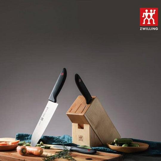 Zwilling ZW-K14 Twin Point Knife Set with birchwood block and vegetables, showcasing affordable luxury in kitchen tools.