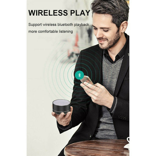 Man enjoying wireless Bluetooth speaker with smartphone, highlighting affordable and quality music experience.