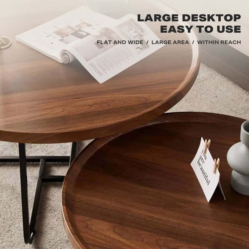 Set of 2 round walnut coffee tables with metal legs, showcasing large flat desktop, elegant design, and versatile placement in living space.