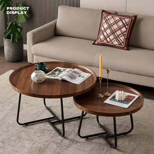 Set of 2 round walnut coffee tables with metal legs in a modern living room, showcasing affordable quality value furniture.