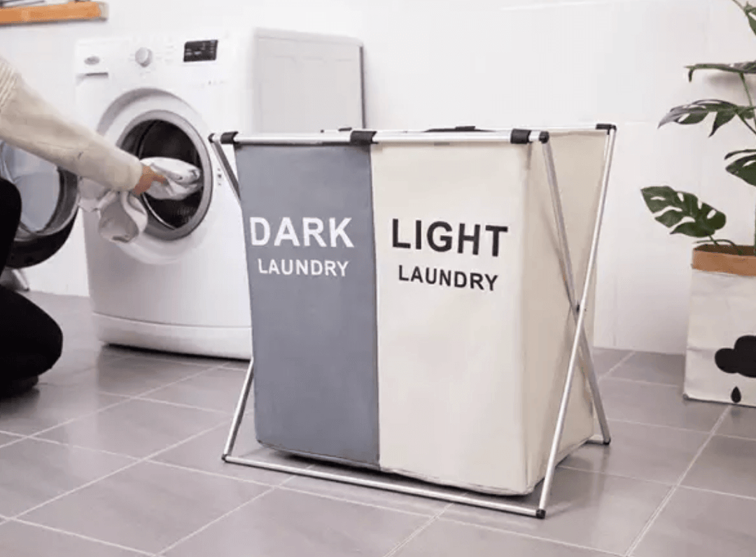 Foldable laundry basket with dark and light compartments, featuring modern design and convenient setup for easy laundry organization.