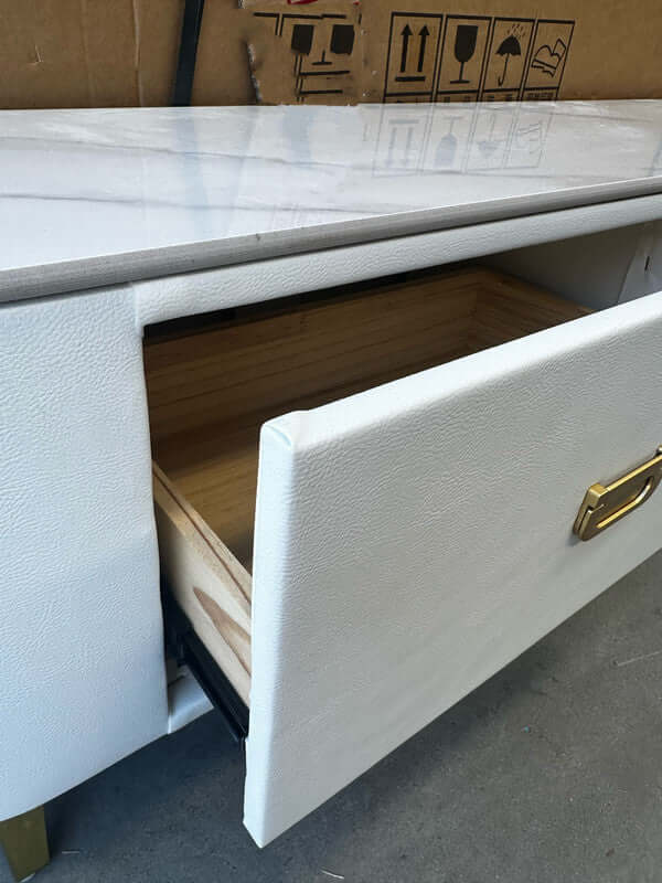 Close-up of the drawer from a chalk sintered stone TV stand, showcasing quality craftsmanship and stylish design elements.