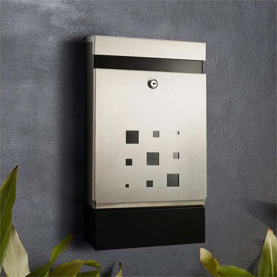 Sandleford stainless steel lockable wall-mounted letterbox with sleek contemporary design against a modern home exterior.