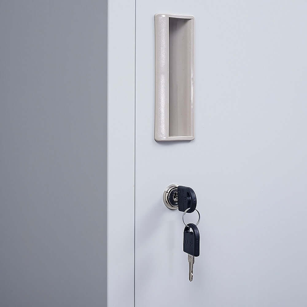 Close-up of a one-door clothing locker cabinet showing the keyhole and handle for secure storage.