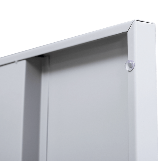 Close-up of a sturdy white metal locker cabinet corner, showcasing quality construction and sleek design.