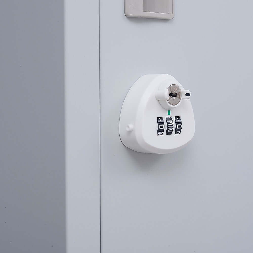 Close-up of a combination lock with key on an office clothing locker, providing secure and affordable storage.