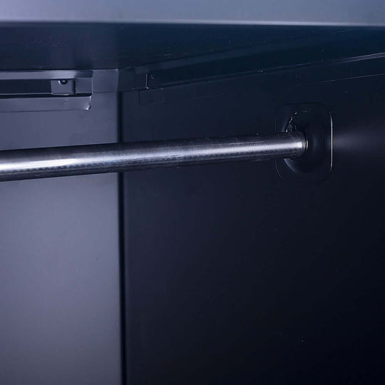 Interior view of a clothing locker cabinet showcasing a sturdy hanging rod for wrinkle-free storage.