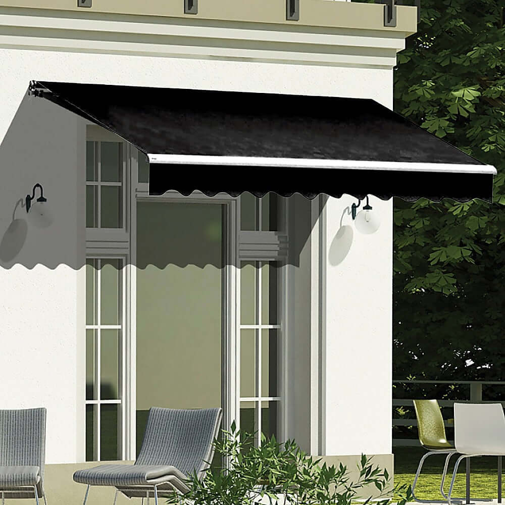 Black retractable outdoor awning providing shade over patio, perfect for summer protection and DIY home improvement.