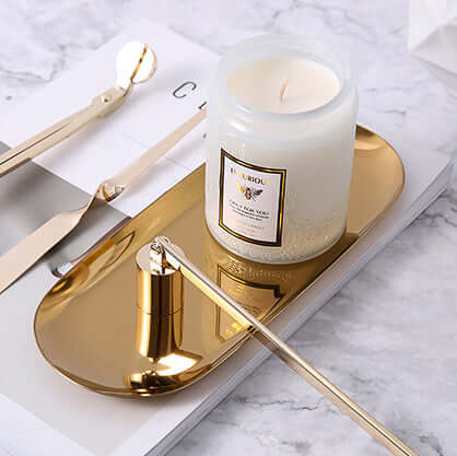 Affordable Faubourg Embossed Scented Candle in sleek glass votive on a stylish gold tray.