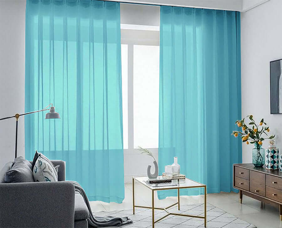 Lake blue sheer voile curtains in modern living room, providing a stylish and affordable home decor solution.