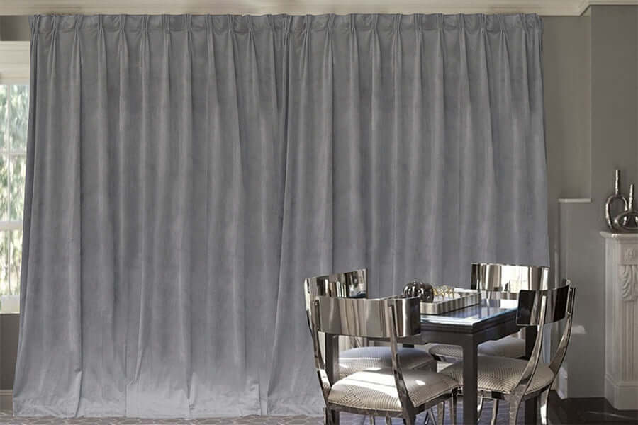 Large grey velvet blockout curtains in a dining room, showcasing luxury, quality, and DIY home decor.