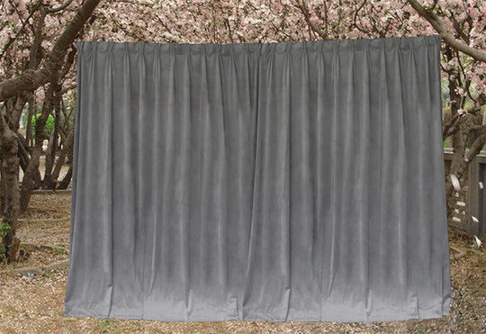 Large grey velvet blockout curtains in a serene outdoor setting, perfect for affordable home decor and DIY projects.