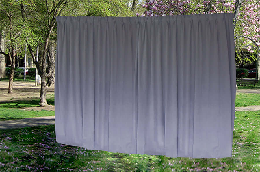 Large purple grey velvet blockout curtains hanging outdoors, showcasing quality fabric and stylish pinch pleat design.