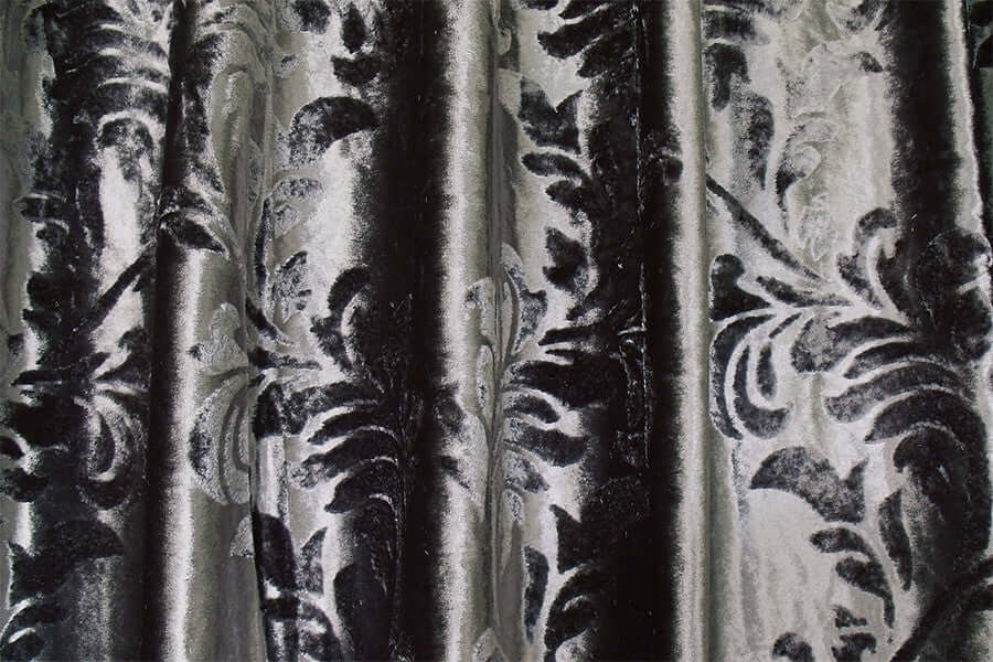 Luxurious silver grey thick velvet curtains with elegant flocked pattern, perfect for home theater decor. Affordable quality drapery.