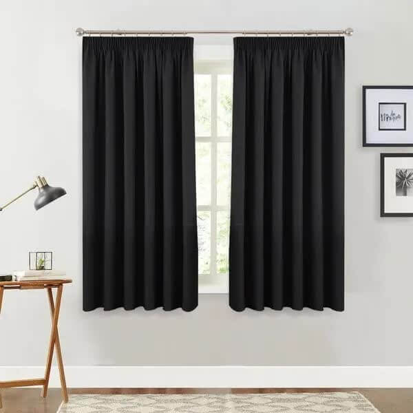 Black pinch pleat blackout curtain panel, 137x160cm, offering affordable luxe DIY window treatment with high-quality fabric.