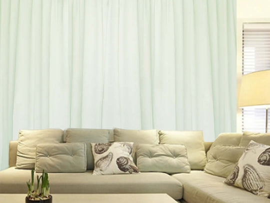 Milk White large curtains with pinch pleat design, 570x270cm, hang elegantly behind a sofa; offers affordable luxe, DIY quality.