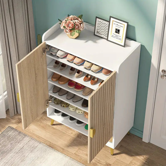 7-tier shoe storage cabinet in wood and gold with adjustable shelves, holding various shoes, placed in a contemporary room setting.