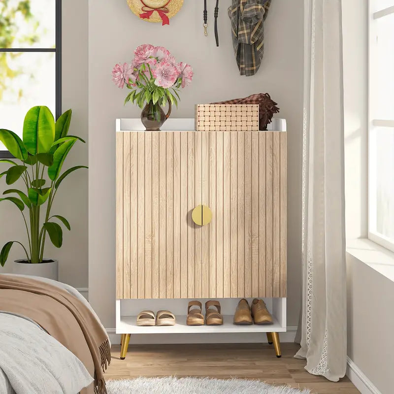 Contemporary 7-tier shoe storage cabinet with wood and gold design, in bedroom setting with plants and decorative items.