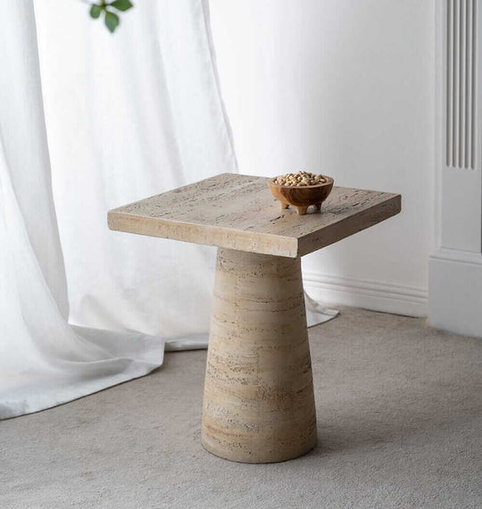 Modern Logan Cement Square Side Table with a bowl of snacks, adding stylish decor to any room. Affordable and quality design.