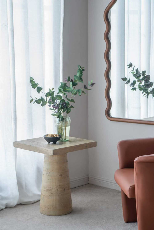 Logan Cement Square Side Table featuring plants and mirror, showcasing affordable luxury and modern decor aesthetics.