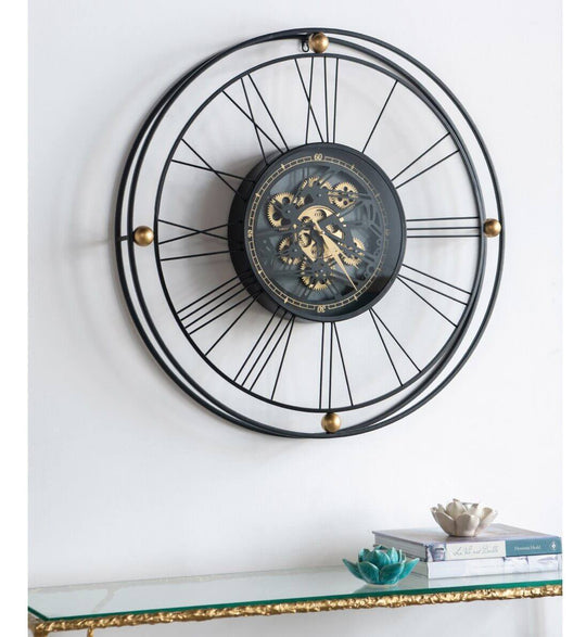 Elegant Traveler Wall Clock with moving 3D mechanism, featuring oversized Roman numerals for minimal and industrial interiors.