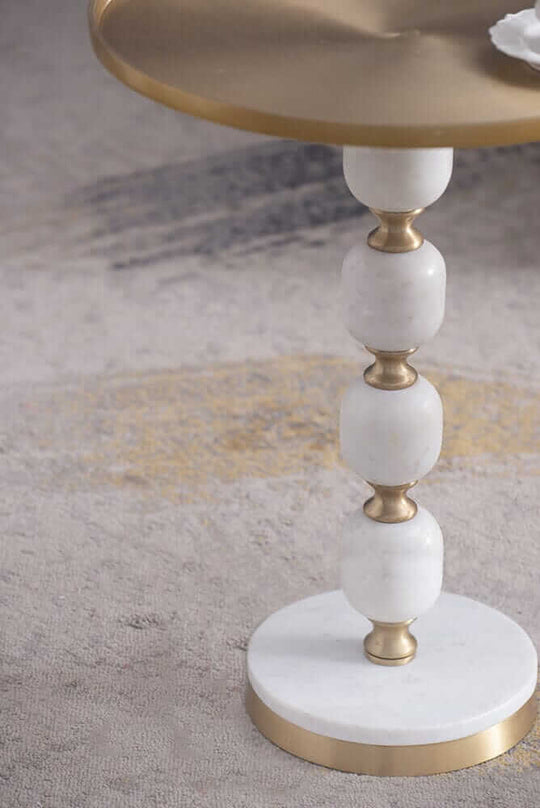 Elegant JESICCA marble and aluminum side table showcasing luxury design and handcrafted quality for stylish interiors.