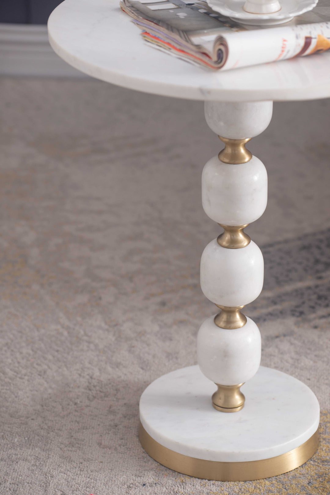 Handcrafted side table with pebble marble top and aluminum base, perfect for luxe home decor. Affordable and stylish accent piece.