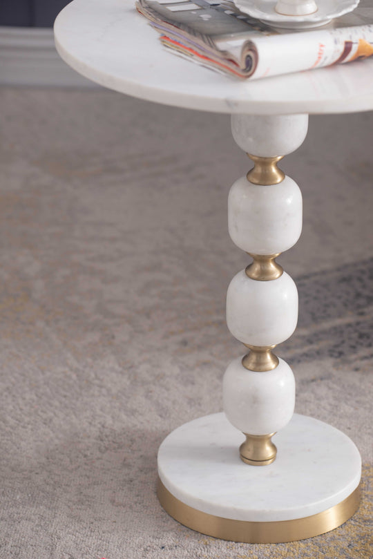 Handcrafted side table with pebble marble top and aluminum base, perfect for luxe home decor. Affordable and stylish accent piece.