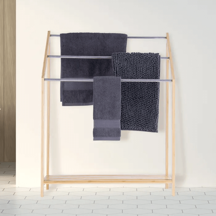 Affordable 85cm bamboo towel rack with 3-tier shelves and towels, perfect for any bathroom decor.