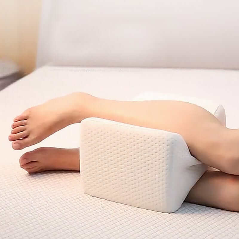 Memory foam sciatica relief leg pillow supporting legs for pain-free sleep, affordable and quality comfort.