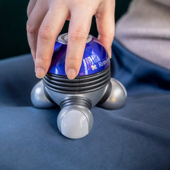 Mini Therapy handheld massager in use, providing affordable and quality relaxation with powerful vibration.