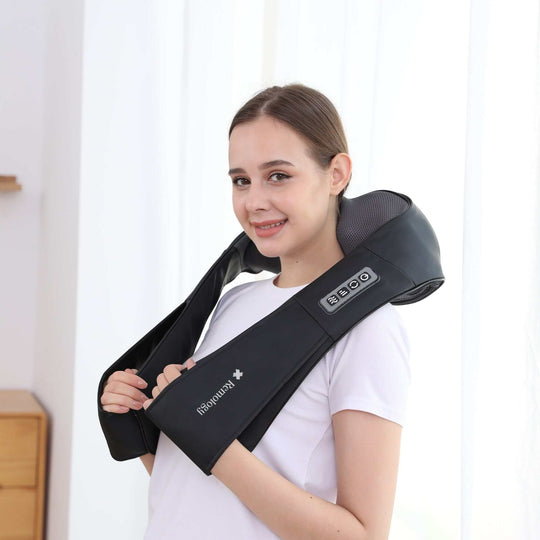 Woman using a heated Shiatsu neck massager for relaxation and muscle relief at home.