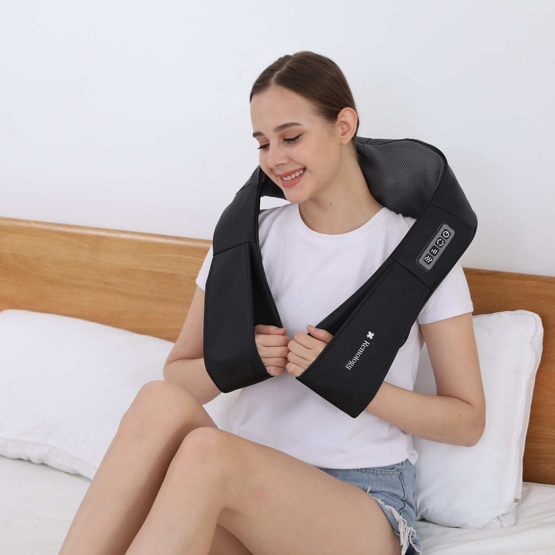 Woman enjoying a Heated Shiatsu Neck Massager for relaxation and muscle relief at home.