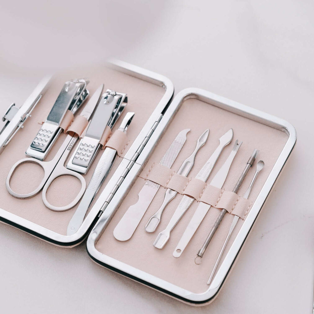 Remology Stainless Steel 10pc Manicure Set in silver case with essential tools for affordable DIY beauty care.