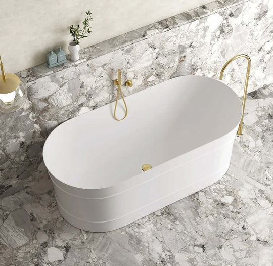 Affordable oval freestanding bathtub in matt white on marble floor, perfect for DIY luxury bathroom upgrades.